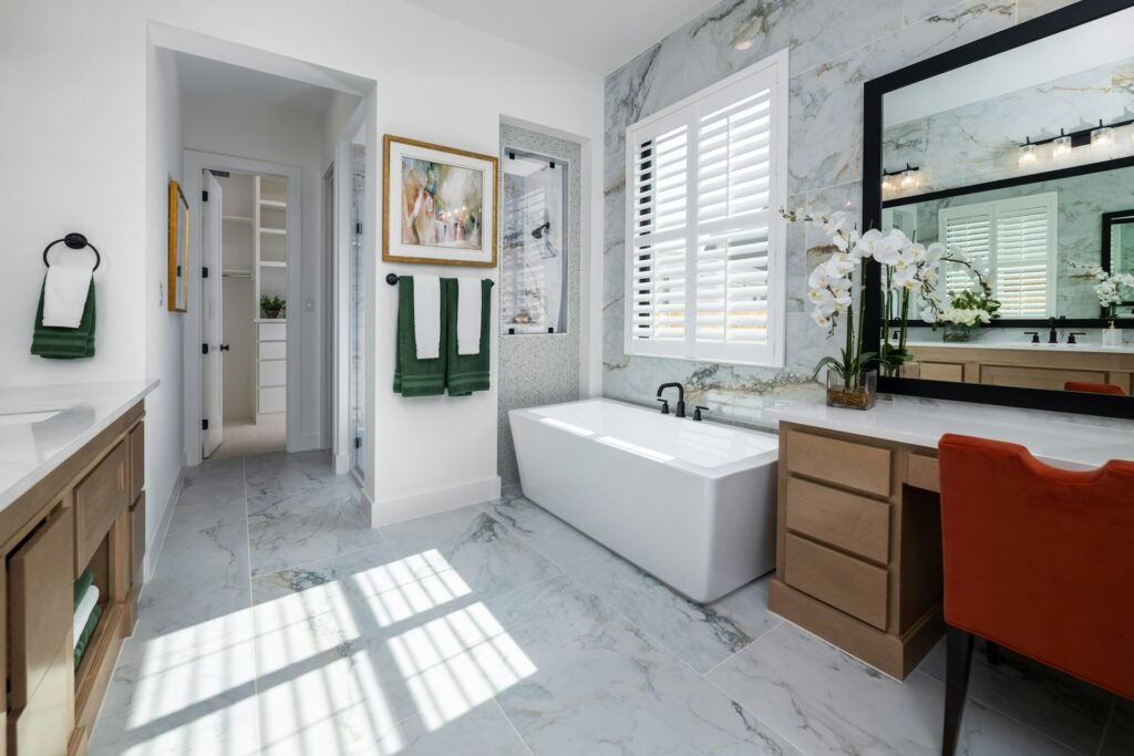 a bathroom with marble flooring and a bathtub